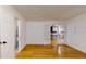 Living room with hardwood floors and french doors with access to kitchen at 2441 Se 38Th St, Ocala, FL 34480