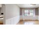 Bright living room offering wood floors, wainscotting, and a lovely pool view at 2441 Se 38Th St, Ocala, FL 34480