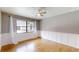 Comfortable living room with hardwood floors, wainscotting detail, and natural light at 2441 Se 38Th St, Ocala, FL 34480
