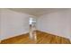 Bright living room featuring hardwood floors, garage access, and an open layout at 2441 Se 38Th St, Ocala, FL 34480
