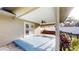 Covered back porch featuring a painted concrete floor, ceiling fan, and swing at 2441 Se 38Th St, Ocala, FL 34480