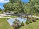 Outdoor patio area featuring a pergola, fire pit, and comfortable seating, perfect for outdoor entertaining at 300 Se Highway 42, Summerfield, FL 34491