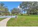 Outdoor patio area featuring a pergola, fire pit, and spacious backyard at 300 Se Highway 42, Summerfield, FL 34491