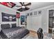 Bedroom with decorations, wood-look floors, closet, and ceiling fan at 300 Se Highway 42, Summerfield, FL 34491