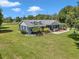 Beautiful single-story home with a well-manicured lawn, mature landscaping, and charming curb appeal at 300 Se Highway 42, Summerfield, FL 34491