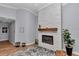 Modern fireplace with a stone surround, complemented by a wooden mantle and stylish decor, adding warmth to the room at 300 Se Highway 42, Summerfield, FL 34491