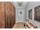 Elegant foyer featuring wood accents, stylish lighting, and decorative mirrors, creating a welcoming entrance at 300 Se Highway 42, Summerfield, FL 34491