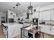 Elegant kitchen featuring a center island, modern appliances, white cabinetry, and a breakfast nook at 300 Se Highway 42, Summerfield, FL 34491