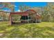 Covered storage barn in a lush, green setting, perfect for boats or equipment at 3000 Pine Grove Ln, Lady Lake, FL 32159