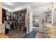 Bathroom showcasing a vanity with granite counters and an adjacent large walk-in closet at 3000 Pine Grove Ln, Lady Lake, FL 32159