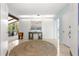Spacious foyer featuring light tile floors, sky-blue walls, and a sailboat painting at 3000 Pine Grove Ln, Lady Lake, FL 32159