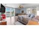 Light-filled bedroom with a ceiling fan, comfortable seating, and direct access to the pool area at 3000 Pine Grove Ln, Lady Lake, FL 32159