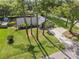 Aerial view of house and lawn with pool in the back at 327 Se 50Th Ave, Ocala, FL 34471