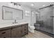 Modern bathroom features a glass shower, updated vanity, and decorative mirror at 327 Se 50Th Ave, Ocala, FL 34471