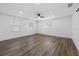 Bright bedroom featuring three large windows and a ceiling fan at 327 Se 50Th Ave, Ocala, FL 34471