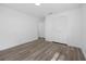 Bright bedroom featuring wood-look flooring and a spacious closet for optimal storage at 327 Se 50Th Ave, Ocala, FL 34471