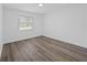 Bedroom with wood-look flooring and a window with natural light at 327 Se 50Th Ave, Ocala, FL 34471
