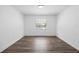 Bright bedroom with a window that fills the space with natural light and wood-look flooring at 327 Se 50Th Ave, Ocala, FL 34471