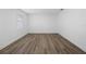 Bright bedroom with a large window that fills the space with natural light and wood-look flooring at 327 Se 50Th Ave, Ocala, FL 34471
