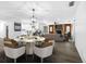 Dining room with hardwood floors, a modern chandelier, and an open floor plan at 327 Se 50Th Ave, Ocala, FL 34471