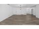 Open concept living space with hardwood floors, neutral walls, and modern lighting fixtures at 327 Se 50Th Ave, Ocala, FL 34471