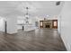 Spacious living room featuring hardwood floors, a stone fireplace, and an open floor plan at 327 Se 50Th Ave, Ocala, FL 34471