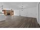 Spacious living area featuring a stone fireplace and hardwood flooring at 327 Se 50Th Ave, Ocala, FL 34471