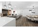 Open-concept living and dining area with modern lighting and furnishings at 327 Se 50Th Ave, Ocala, FL 34471