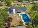 Aerial view showcases a stunning pool, backyard, and the back of the house at 327 Se 50Th Ave, Ocala, FL 34471