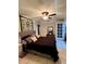 Well-lit bedroom with a queen-sized bed, tiled floors and decorative wall art at 3833 Ne 17Th Street Cir, Ocala, FL 34470