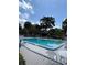 Community pool and cabana with lounge chairs, perfect for enjoying sunny days at 3833 Ne 17Th Street Cir, Ocala, FL 34470