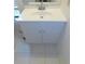 Bathroom features a modern vanity with a white countertop, sink and white cabinets at 3856 Ne 17Th Street Cir, Ocala, FL 34470