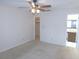 Bright bedroom includes ceiling fan, closet, and ensuite bathroom at 3856 Ne 17Th Street Cir, Ocala, FL 34470