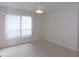 Bedroom with a window, blinds, carpet, and ceiling fan with light at 3856 Ne 17Th Street Cir, Ocala, FL 34470