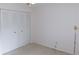 Bedroom with a folding door closet, fan, carpeted floor, and base molding at 3856 Ne 17Th Street Cir, Ocala, FL 34470