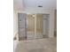 Mirrored closet space with shelving and access to the room beyond at 3856 Ne 17Th Street Cir, Ocala, FL 34470