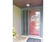 The front door with sidelights enhances the home's entryway at 3856 Ne 17Th Street Cir, Ocala, FL 34470