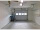 Spacious two-car garage with painted walls, shelving, and ample room for parking and storage at 3856 Ne 17Th Street Cir, Ocala, FL 34470