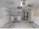 Well-lit garage featuring laundry machines, shelving, and plenty of space for storage and functionality at 3856 Ne 17Th Street Cir, Ocala, FL 34470