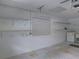 Clean garage interior with storage shelves, pegboard, and laundry area offering practical space at 3856 Ne 17Th Street Cir, Ocala, FL 34470