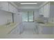 Bright kitchen featuring white cabinetry, a window and white appliances including a refrigerator and oven at 3856 Ne 17Th Street Cir, Ocala, FL 34470