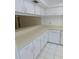 Spacious kitchen with long countertop and white cabinets at 3856 Ne 17Th Street Cir, Ocala, FL 34470