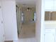Inviting living room featuring neutral walls and flooring with slider door access to the outside at 3856 Ne 17Th Street Cir, Ocala, FL 34470