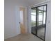 View of the interior, glass sliding doors lead to a sunroom at 3856 Ne 17Th Street Cir, Ocala, FL 34470