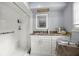 Bathroom featuring a vanity with a countertop, a mirror, and a shower at 4025 Ne 18Th St, Ocala, FL 34470