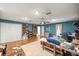 Spacious bedroom with parquet floors, a ceiling fan, and generous closet space at 4025 Ne 18Th St, Ocala, FL 34470
