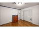 Bedroom featuring hardwood floors, neutral walls, and closet storage at 4025 Ne 18Th St, Ocala, FL 34470