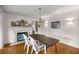 Cozy dining area featuring a fireplace, chandelier, and classic decor at 4025 Ne 18Th St, Ocala, FL 34470