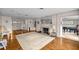 Spacious living room with a fireplace, hardwood floors, and classic decor at 4025 Ne 18Th St, Ocala, FL 34470
