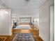 Bright living room with wood floors, fireplace, and large windows at 4025 Ne 18Th St, Ocala, FL 34470